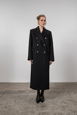 Black coat with various gold buttons