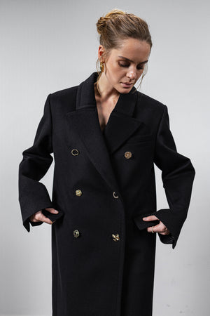 Black coat with various gold buttons