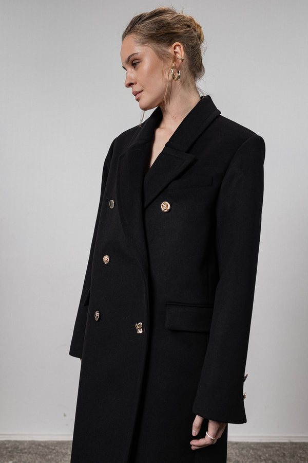 Black coat with various gold buttons