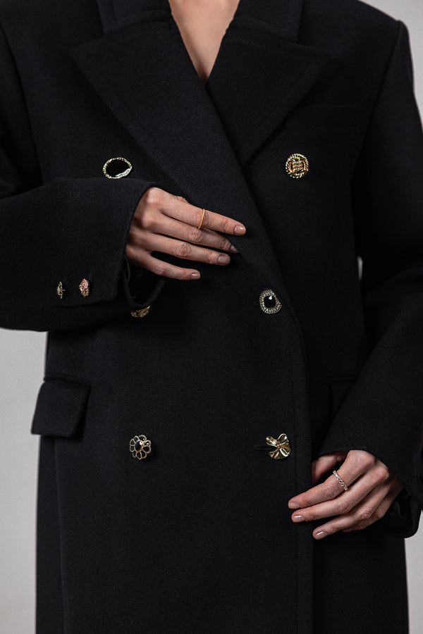 Black coat with various gold buttons