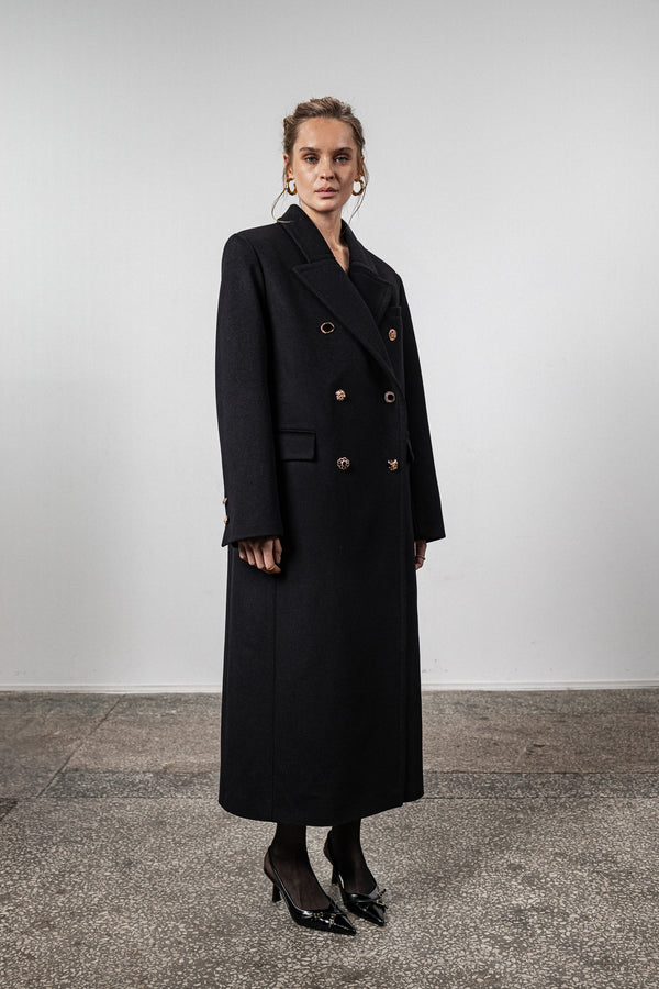 Black coat with various gold buttons