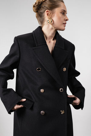 Black coat with various gold buttons