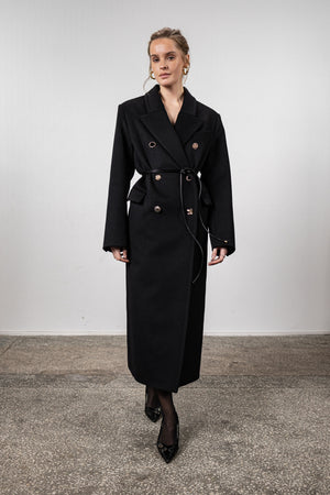 Black coat with various gold buttons
