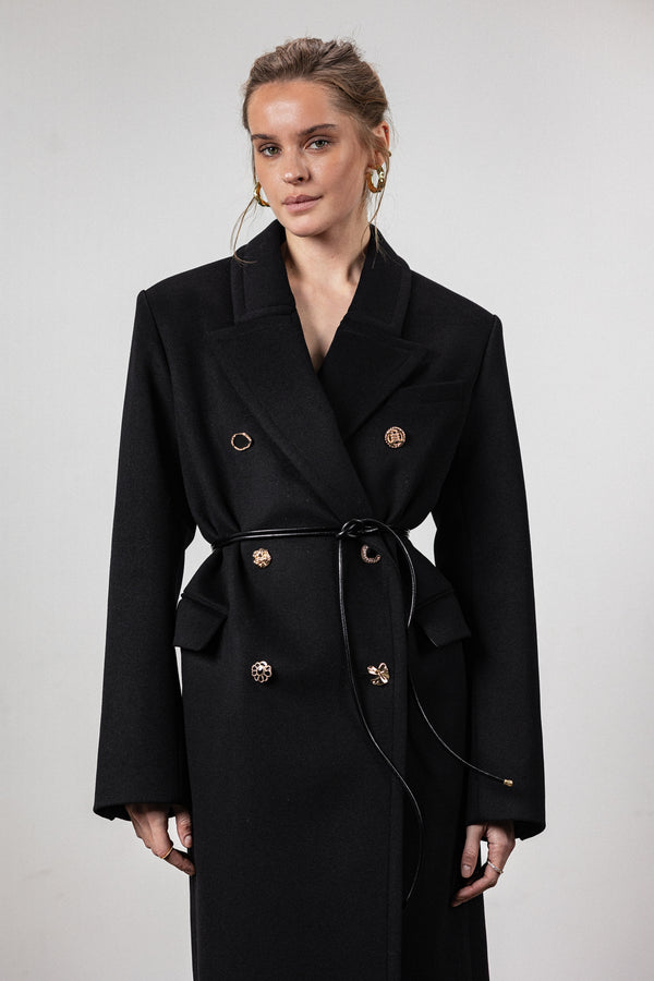 Black coat with various gold buttons